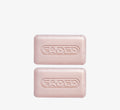 Brightening cleansing bars from Topicals Faded shown as two pink embossed bars stacked on a white background.